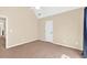 A naturally lit bedroom with an attached door and carpeted floors at 3865 Pointer Rd, Loganville, GA 30052