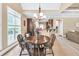 Bright breakfast nook with large windows, and adjacent views of the kitchen and living area at 3865 Pointer Rd, Loganville, GA 30052