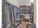 Walk-in closet featuring metal racks and shelves to efficiently store clothing and shoes at 3865 Pointer Rd, Loganville, GA 30052
