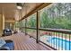 This large deck features an outdoor seating area and a view of the pool at 3865 Pointer Rd, Loganville, GA 30052