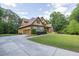 Charming two-story home with manicured lawn and three car garage at 3865 Pointer Rd, Loganville, GA 30052