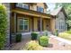 Home with stone accents, manicured lawn, and covered front porch with stone walkway at 3865 Pointer Rd, Loganville, GA 30052
