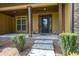 Inviting front porch with stone columns, stone accents, and an elegant front door at 3865 Pointer Rd, Loganville, GA 30052