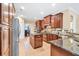 Well-equipped kitchen featuring granite countertops, a center island, and modern appliances at 3865 Pointer Rd, Loganville, GA 30052