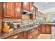 Gourmet kitchen with granite countertops, stainless steel appliances, and custom cabinetry at 3865 Pointer Rd, Loganville, GA 30052