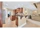 Open-concept kitchen featuring granite countertops, stainless appliances and breakfast bar at 3865 Pointer Rd, Loganville, GA 30052