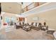 Spacious living room with two-story ceilings, fireplace, and open layout to the kitchen at 3865 Pointer Rd, Loganville, GA 30052