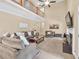 Open-concept living room with a fireplace, tall ceilings, and a clear view of the second story at 3865 Pointer Rd, Loganville, GA 30052