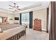Bedroom featuring a tray ceiling, carpet flooring, and wooden furniture set at 3865 Pointer Rd, Loganville, GA 30052