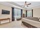 Main bedroom with carpet, a tray ceiling, and direct access to the outdoor deck at 3865 Pointer Rd, Loganville, GA 30052