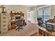 Office with large desk, office chair, file cabinets and lots of natural light at 3865 Pointer Rd, Loganville, GA 30052