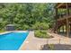 Sparkling backyard pool with gazebo and chairs, perfect for entertaining at 3865 Pointer Rd, Loganville, GA 30052