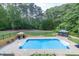 Stunning backyard pool area with gazebo, and lounge seating at 3865 Pointer Rd, Loganville, GA 30052
