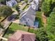 Aerial view of the home with fenced backyard, deck, lush greenery, and mature trees at 4815 Westgate Drive, Cumming, GA 30040