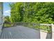 Large wooden back deck with views of a backyard at 4815 Westgate Drive, Cumming, GA 30040