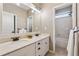 Bathroom with double vanity, ample storage, and separate toilet and shower area at 4815 Westgate Drive, Cumming, GA 30040