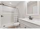 Clean bathroom with white tiled shower, modern sink, and fixtures at 4815 Westgate Drive, Cumming, GA 30040