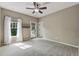 Bedroom with neutral carpet and private porch at 4815 Westgate Drive, Cumming, GA 30040