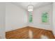 Bright bedroom featuring hardwood floors, natural light and recessed lighting at 4815 Westgate Drive, Cumming, GA 30040