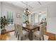 Elegant dining room featuring a modern chandelier and large windows at 4815 Westgate Drive, Cumming, GA 30040