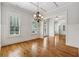 Elegant dining room with hardwood floors, chandelier, and bright windows at 4815 Westgate Drive, Cumming, GA 30040