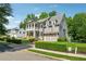Beautifully landscaped home with a covered front porch and an attached garage at 4815 Westgate Drive, Cumming, GA 30040