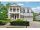 Charming two-story home with a landscaped yard and a welcoming front porch at 4815 Westgate Drive, Cumming, GA 30040