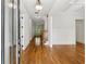 Spacious foyer with hardwood floors, white trim, and a view of the staircase at 4815 Westgate Drive, Cumming, GA 30040
