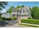 Charming two-story home with a manicured lawn, a welcoming porch, and an attached two-car garage at 4815 Westgate Drive, Cumming, GA 30040