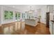 Bright, open kitchen featuring stainless steel appliances and a granite island at 4815 Westgate Drive, Cumming, GA 30040