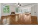 Bright living room featuring a fireplace, hardwood floors, and large windows at 4815 Westgate Drive, Cumming, GA 30040