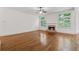 Cozy living room with a stone fireplace, large windows and hardwood floors at 4815 Westgate Drive, Cumming, GA 30040