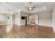 This is a large main bedroom with hardwood floors, a ceiling fan, and a view of the landing at 4815 Westgate Drive, Cumming, GA 30040