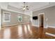 Spacious main bedroom featuring hardwood floors, a tray ceiling, and ample natural light at 4815 Westgate Drive, Cumming, GA 30040