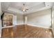 Spacious main bedroom featuring tray ceilings, hardwood floors, and neutral paint at 4815 Westgate Drive, Cumming, GA 30040