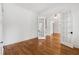 Office space featuring hardwood floors, white trim, and glass paneled doors at 4815 Westgate Drive, Cumming, GA 30040