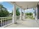 Balcony with white columns overlooking a lush, green yard at 4815 Westgate Drive, Cumming, GA 30040