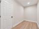 Small, well-lit room with wood-look floors, neutral paint, and white trim at 4815 Westgate Drive, Cumming, GA 30040