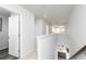 Upstairs hallway featuring neutral tones and an open view to the kitchen below at 502 Regency Trl, Acworth, GA 30102