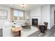 Comfortable living room with a fireplace, lots of natural light, and modern decor at 502 Regency Trl, Acworth, GA 30102