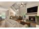 Open living space with fireplace, tv, lots of natural light and a wooden chest at 504 River Run Dr, Atlanta, GA 30350