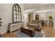 Comfortable living room featuring wood floors, unique mirror and plenty of space to entertain at 504 River Run Dr, Atlanta, GA 30350