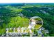 Beautiful aerial view of a neighborhood with mature trees and well-kept lawns at 5251 Centennial Hill Nw Dr, Acworth, GA 30102