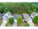 Scenic aerial view of the residences with manicured lawns surrounded by lush greenery at 5251 Centennial Hill Nw Dr, Acworth, GA 30102