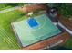 Aerial view of fenced basketball court with well-maintained green surface, offering a great space for sports and recreation at 5251 Centennial Hill Nw Dr, Acworth, GA 30102