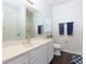 Well-lit bathroom features a vanity, large mirror, white cabinets, and modern fixtures at 5251 Centennial Hill Nw Dr, Acworth, GA 30102