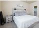 Comfortable bedroom with a wooden headboard and modern lamps perfect for a cozy night's sleep at 5251 Centennial Hill Nw Dr, Acworth, GA 30102