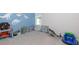 This adorable bedroom features dinosaur-themed decor and carpeted flooring for a cozy vibe at 5251 Centennial Hill Nw Dr, Acworth, GA 30102
