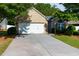 Beautiful brick home featuring a two-car garage and a well-maintained lawn at 5251 Centennial Hill Nw Dr, Acworth, GA 30102