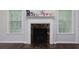 Elegant fireplace with marble accents and classic mantel at 5251 Centennial Hill Nw Dr, Acworth, GA 30102